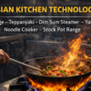 Professional wok cooking on gas wok range in Asian restaurant kitchen